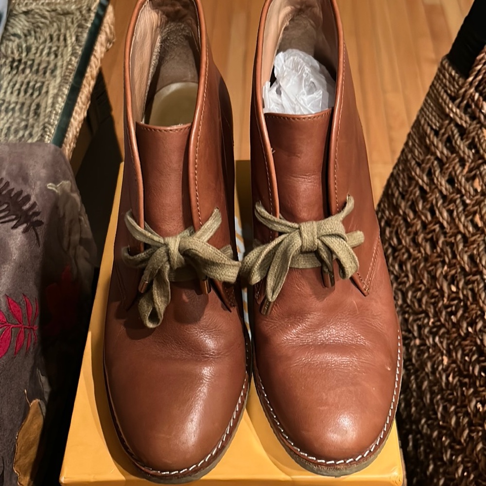 Size nine laced heeled tan boots